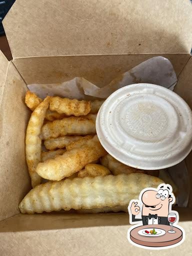 Customer photo of crinkle-cut fries and a sauce container